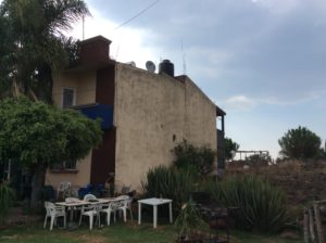 El Cebolla's house. The black cylinder on the roof top is solar hot water. This method is seen commonly seen here.