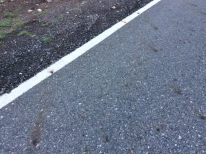 Aggregate high in iron content staining the highway with rust. 