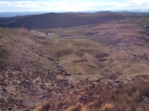 View from the top looking at the highway and camp in the meadow.